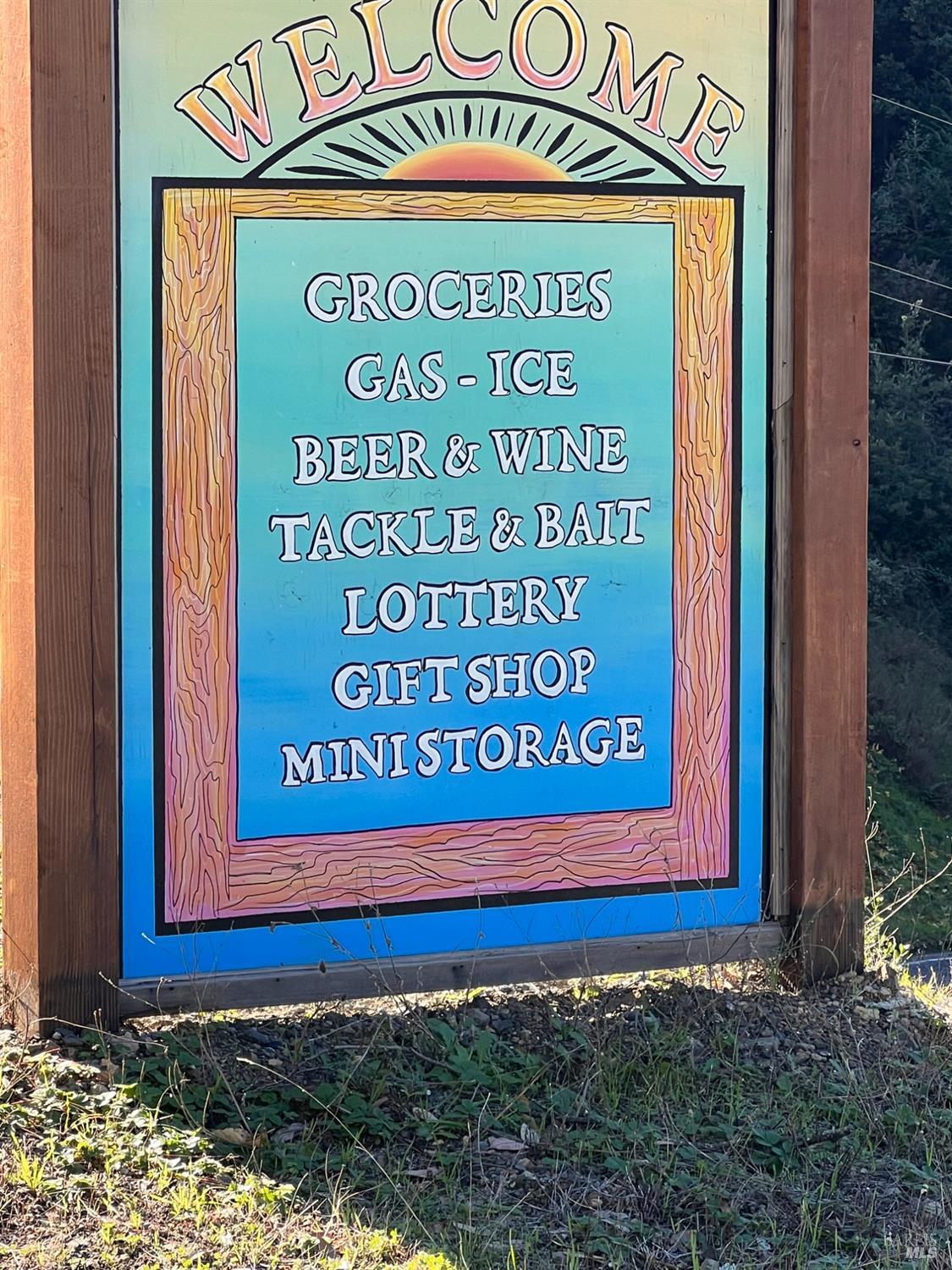 566 Redwood Road Whitethorn, CA 95589 - Photo 8 of 11 a sign on the side of a building