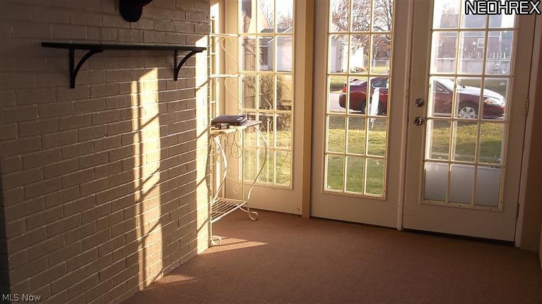 4335 7th Street Northwest Canton, OH 44708 - Photo 18 of 21 The breezeway has been restyled and includes new carpet for a bright sunny Sun Room