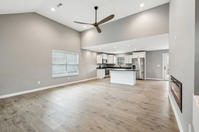 a view of a kitchen with a sink and a window