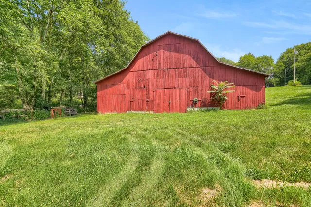 a view of a backyard with a small cabin