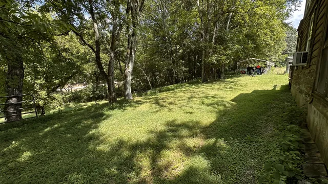 a view of grassy field with benches