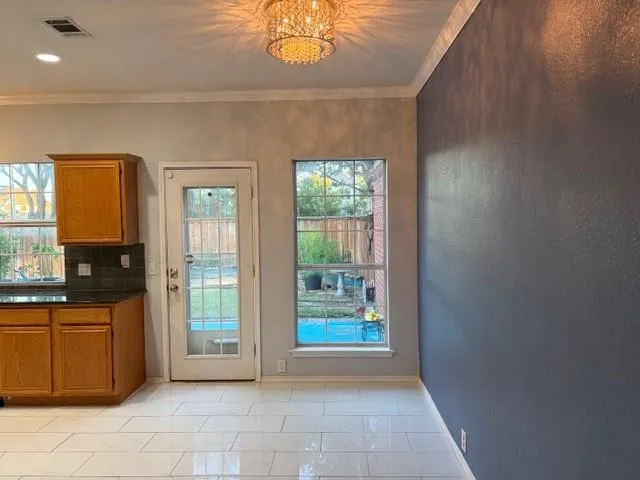 a view of a kitchen with furniture and windows