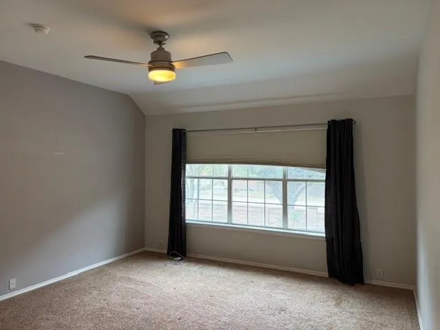 a bathroom with a granite countertop sink a mirror a bathtub and shower