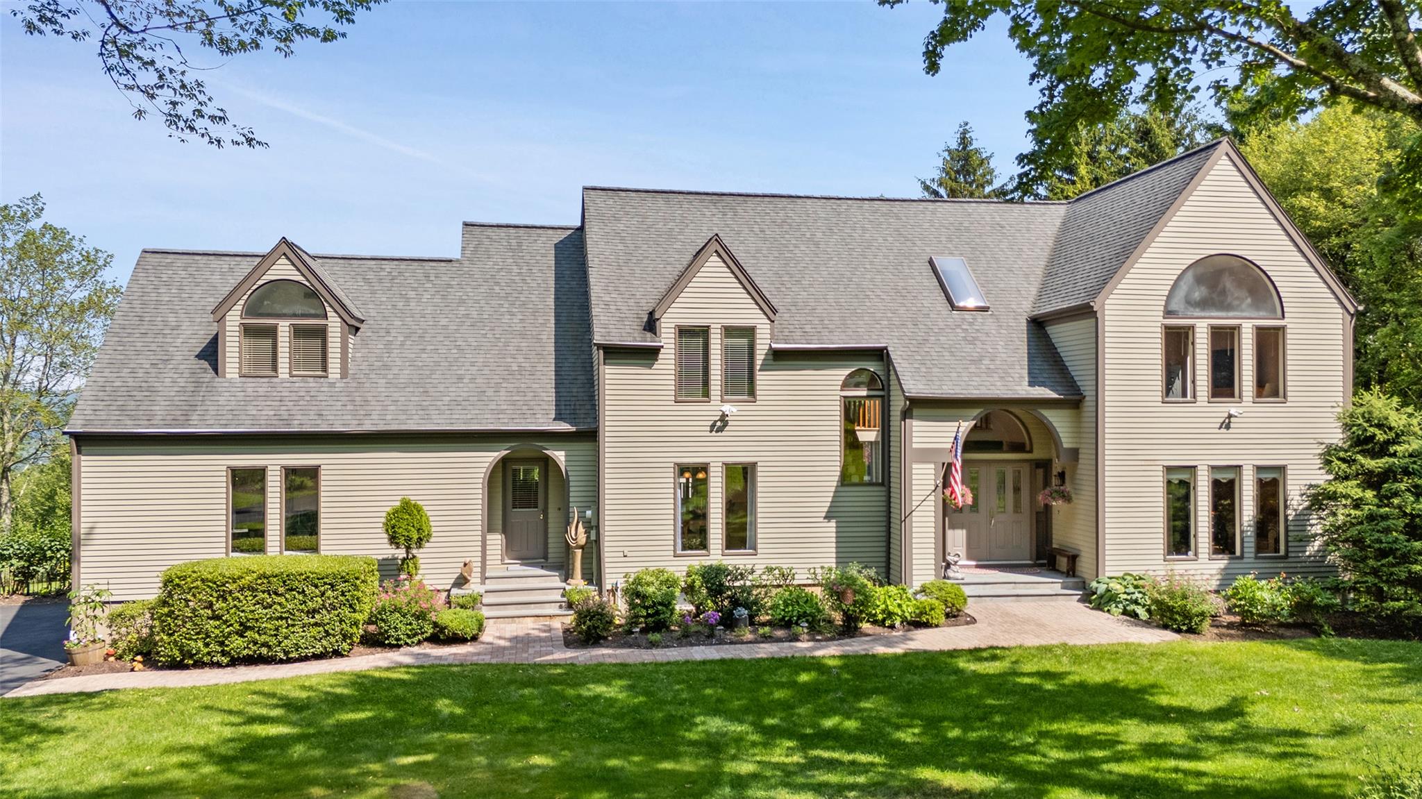 front view of a house with a yard
