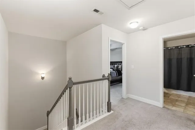 a view of a room with a ceiling fan and a window