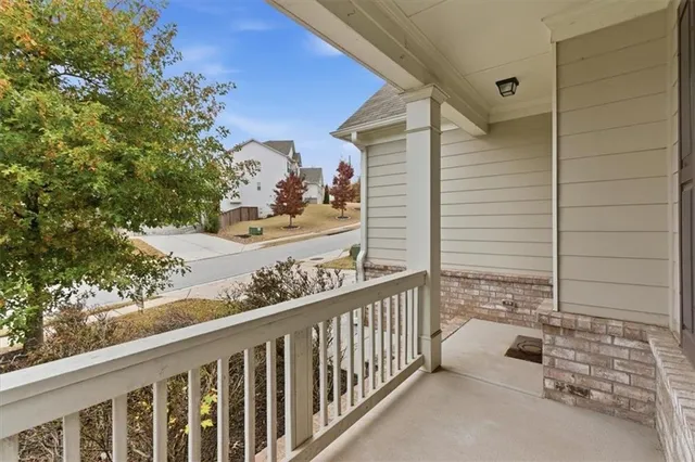 a view of a hallway with wooden floor and entryway