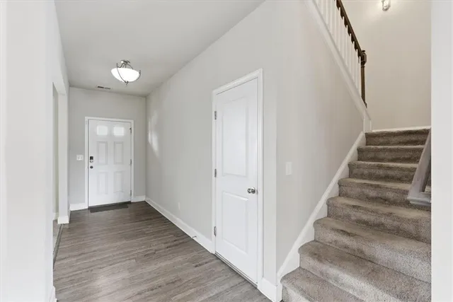 a view of a workspace with a window and bathroom