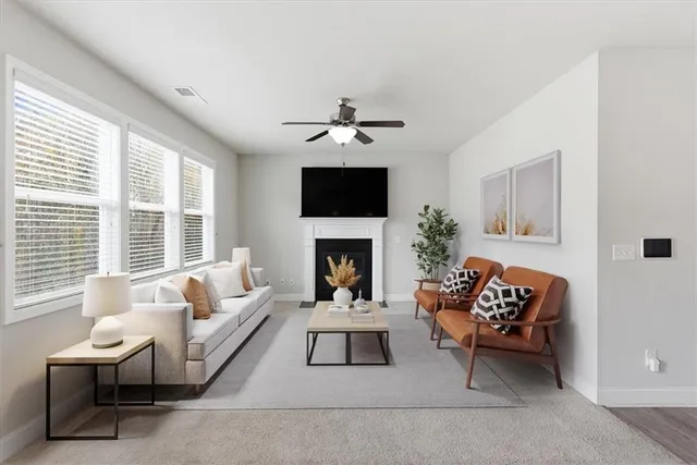 a large kitchen with granite countertop lots of counter top space and stainless steel appliances