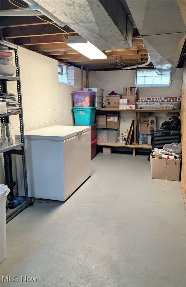 17567 Howe Road Strongsville, OH 44136 - Photo 29 of 30 View of Storage Area. Built In Shelving, Shelfing Rack and Freezer Stay