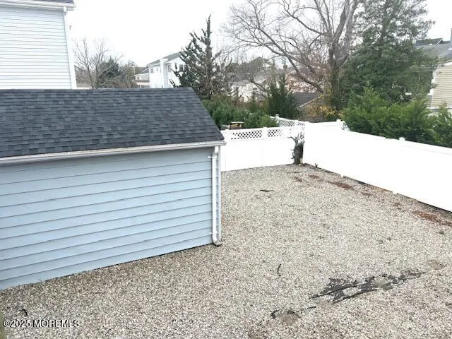 a view of a backyard of the house