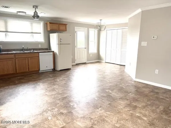 a view of a kitchen with a stove cabinets and a kitchen