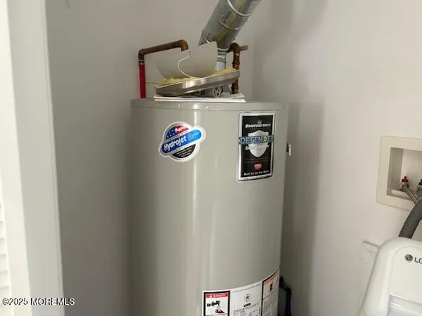 a kitchen with a refrigerator and cabinets