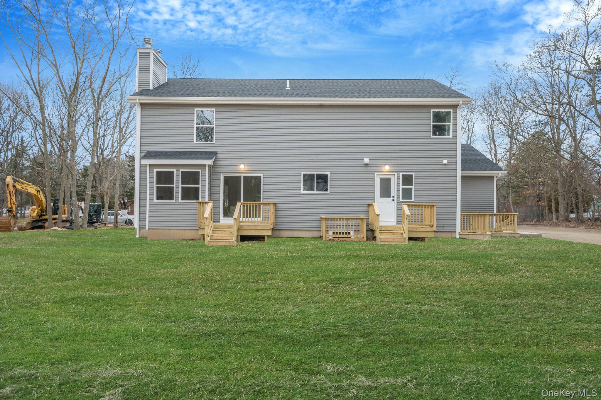 63 B Blydenburgh Road Centereach, NY 11720 - Photo 37 of 38 a view of a house with a backyard
