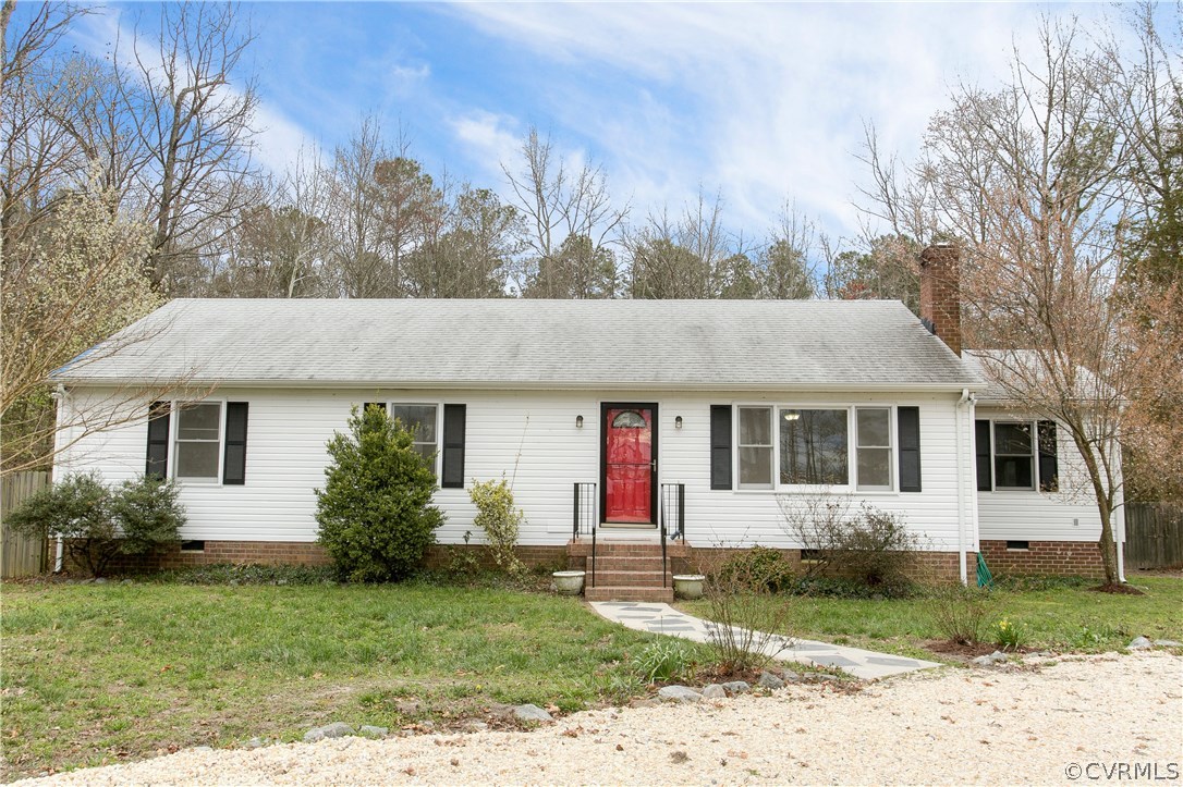 7413 River Road Hanover, VA 23069 - Photo 1 of 30 a front view of a house with garden