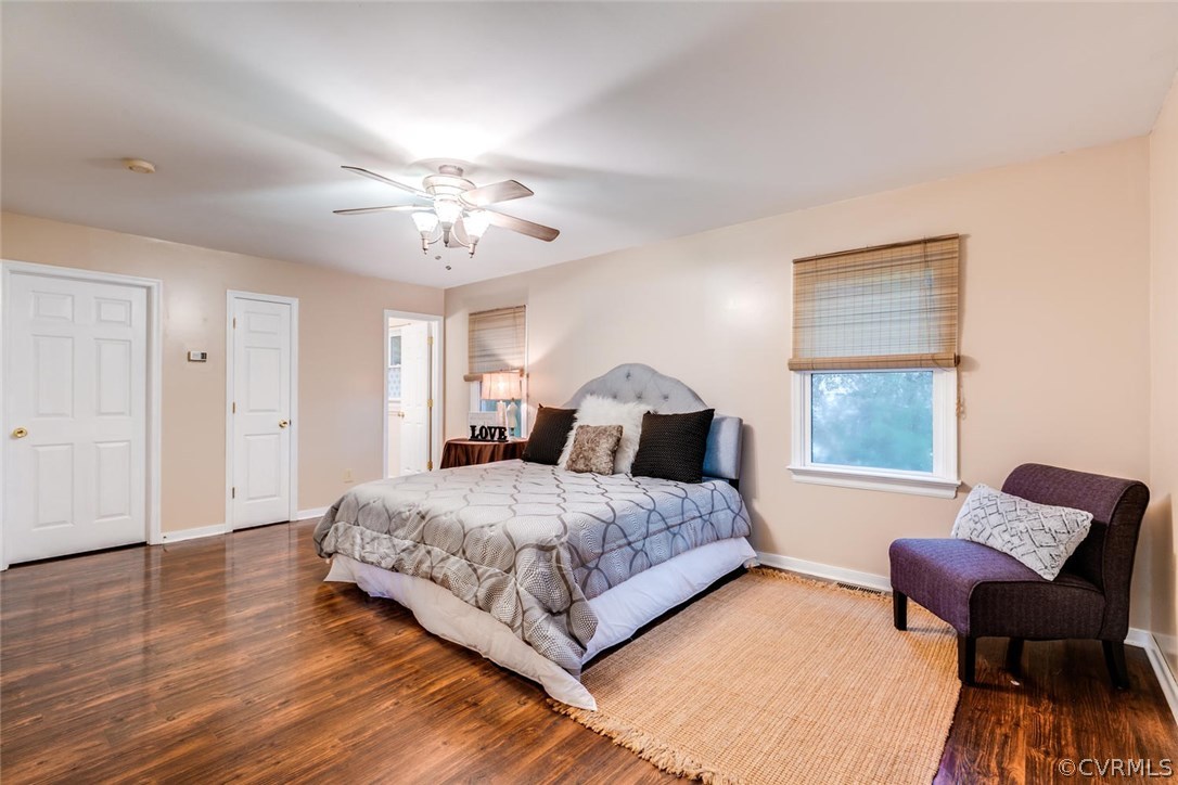 7413 River Road Hanover, VA 23069 - Photo 11 of 30 a bedroom with a bed and a chair