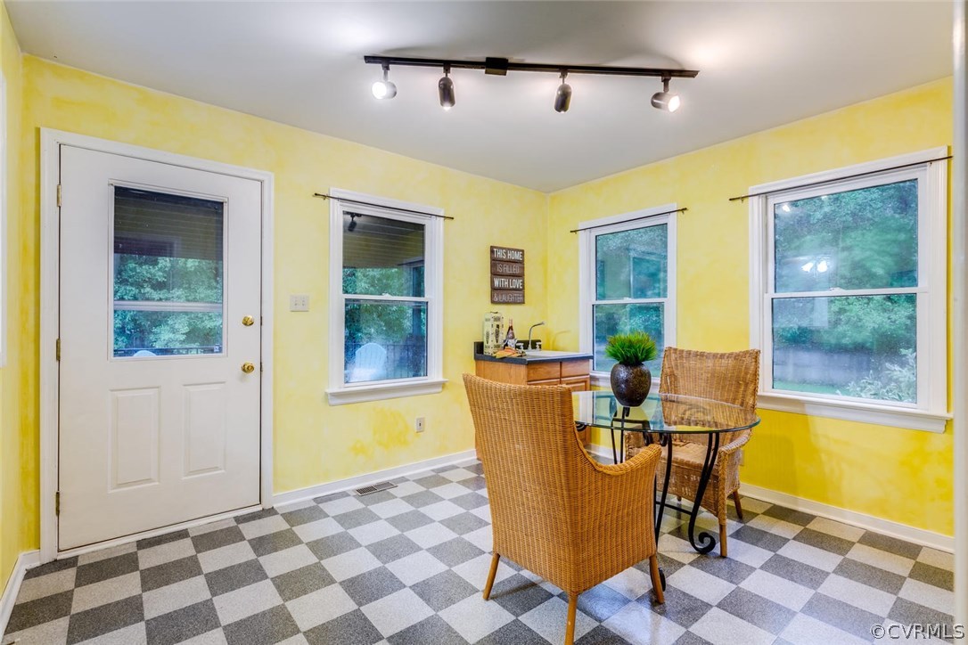 7413 River Road Hanover, VA 23069 - Photo 13 of 30 a view of a dining room with furniture and a window