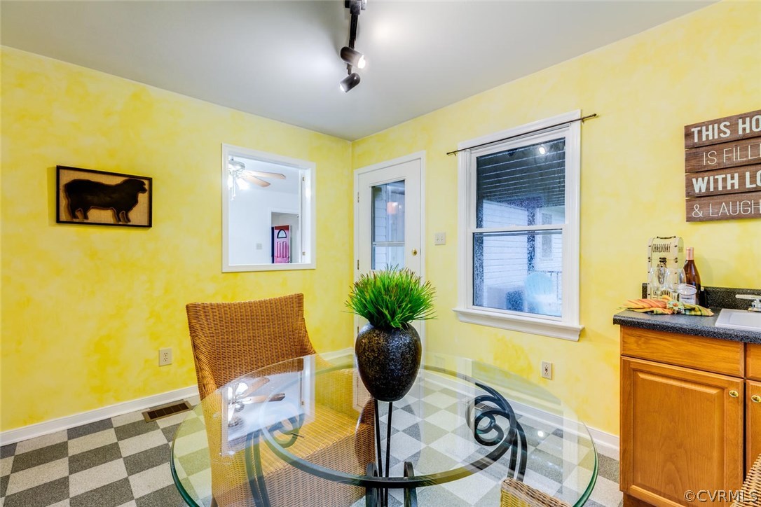 7413 River Road Hanover, VA 23069 - Photo 14 of 30 a view of a dining room with furniture and chandelier
