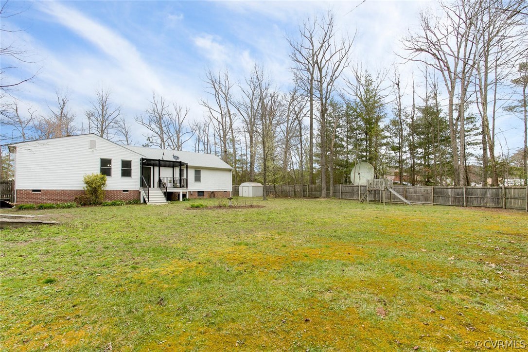 7413 River Road Hanover, VA 23069 - Photo 27 of 30 a front view of house with yard and lake