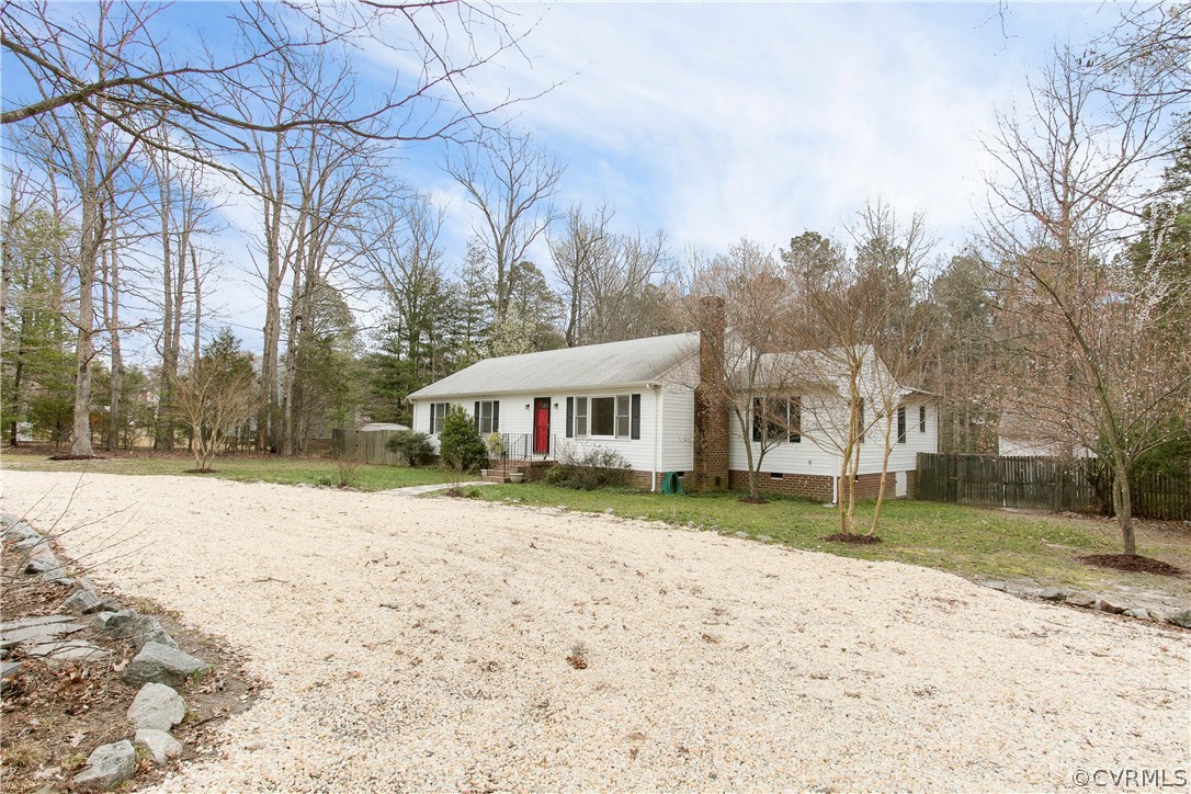 7413 River Road Hanover, VA 23069 - Photo 29 of 30 a view of a house with a yard covered with snow in the yard