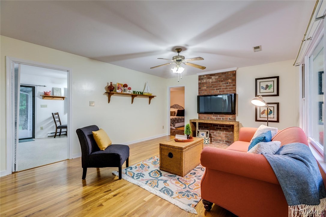 7413 River Road Hanover, VA 23069 - Photo 5 of 30 a living room with furniture and a flat screen tv