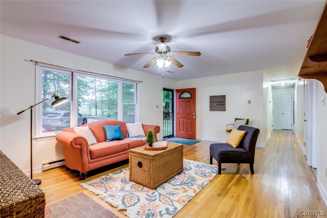 7413 River Road Hanover, VA 23069 - Photo 6 of 30 a living room with furniture and a large window