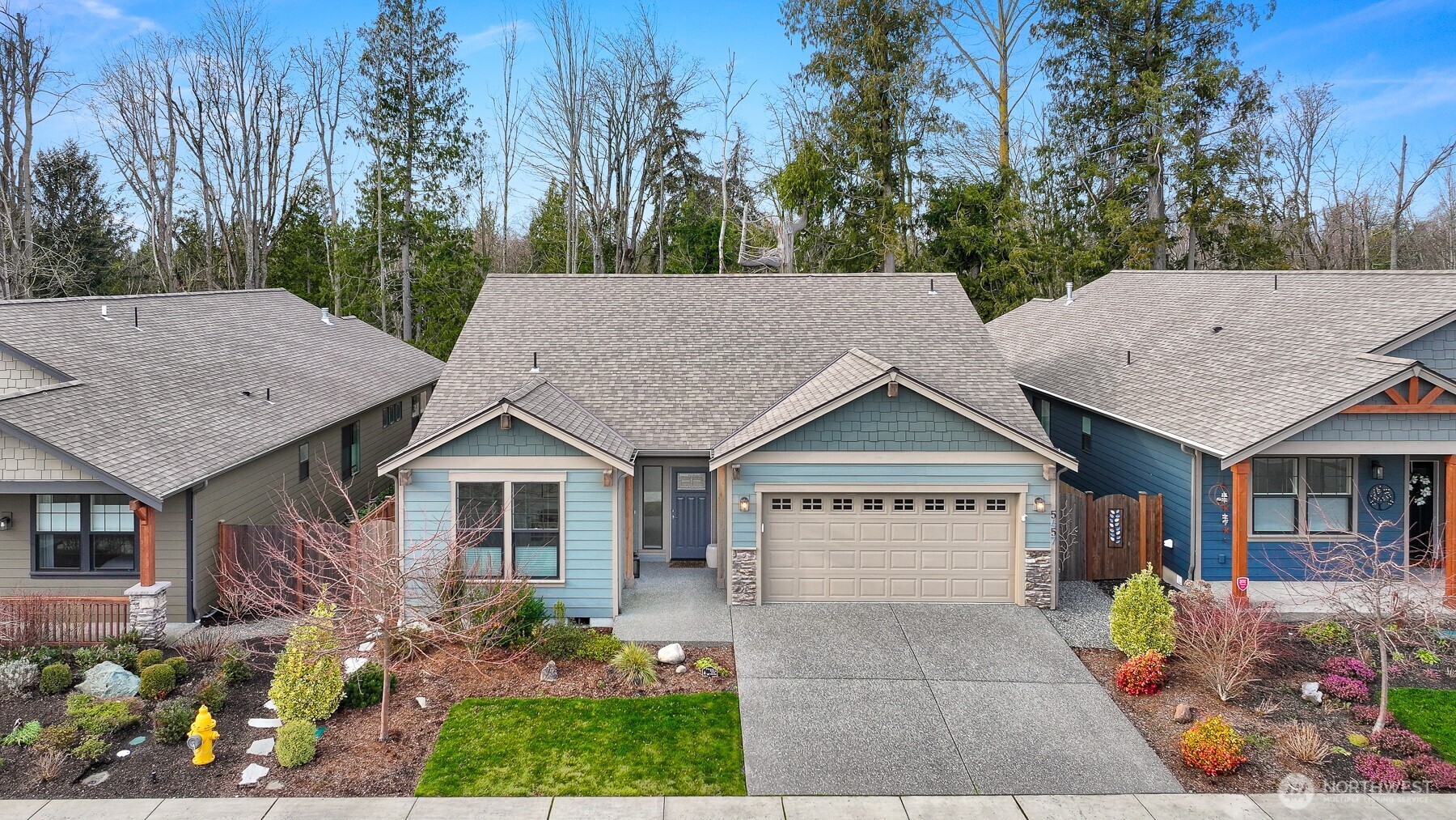 5457 Shields Road Ferndale, WA 98248 - Photo 1 of 39 a view of a house with a yard and potted plants