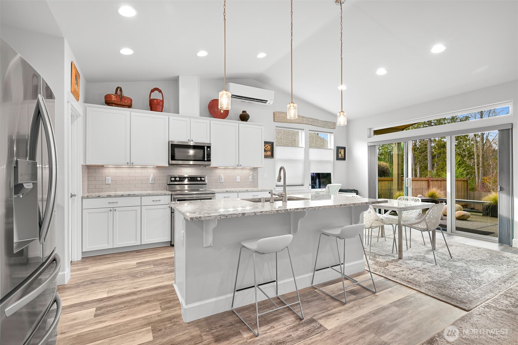 5457 Shields Road Ferndale, WA 98248 - Photo 9 of 39 a kitchen with kitchen island stainless steel appliances a stove a sink and a refrigerator