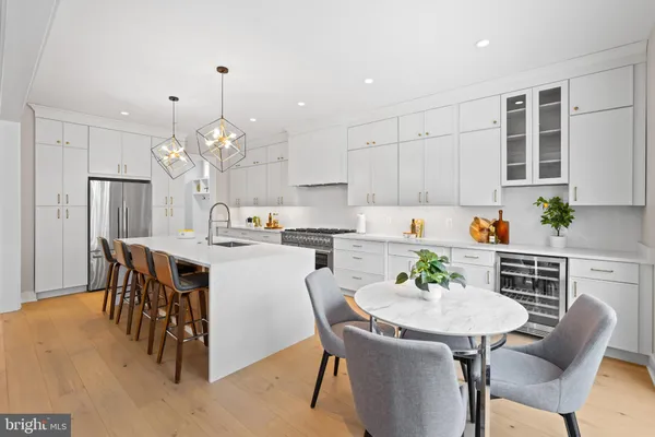 a kitchen with a table and chairs