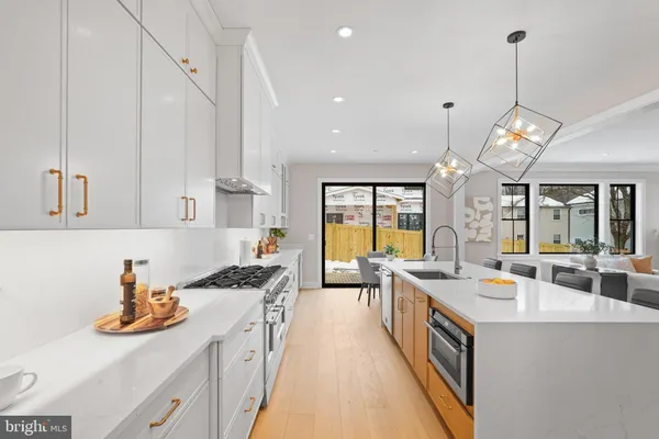 a view of a bedroom with wooden floor