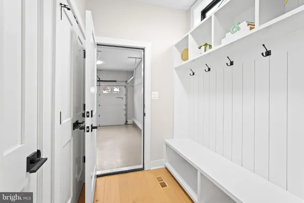 a spacious bathroom with a granite countertop sink and a bathtub