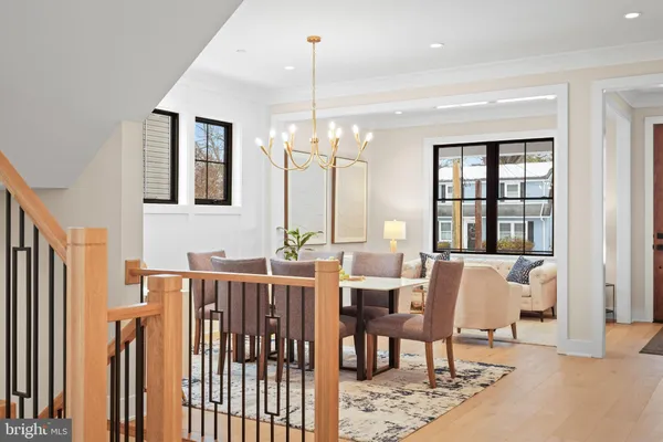 a bathroom with a double vanity sink toilet mirror and bathtub