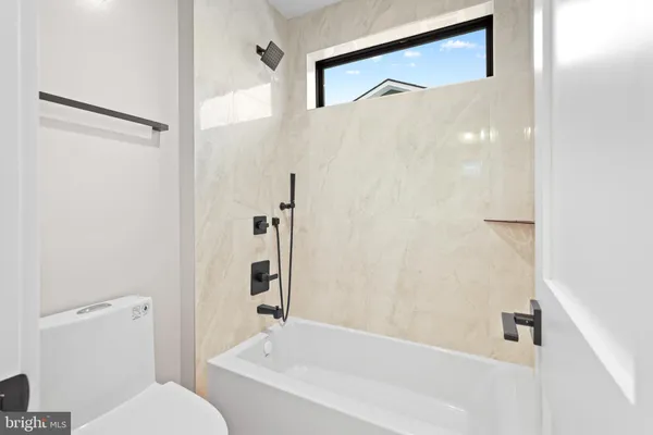 a bathroom with a shower and a toilet