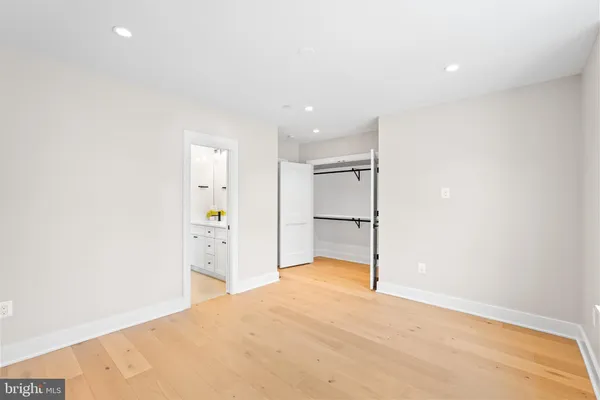 a view of a dining room with furniture a rug and wooden floor