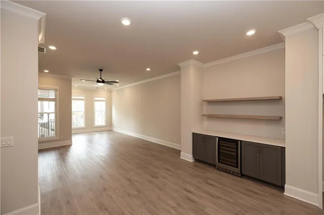 a view of a room with wooden floor and window