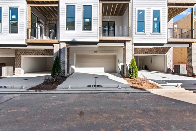 a view of a parking space in front of a building