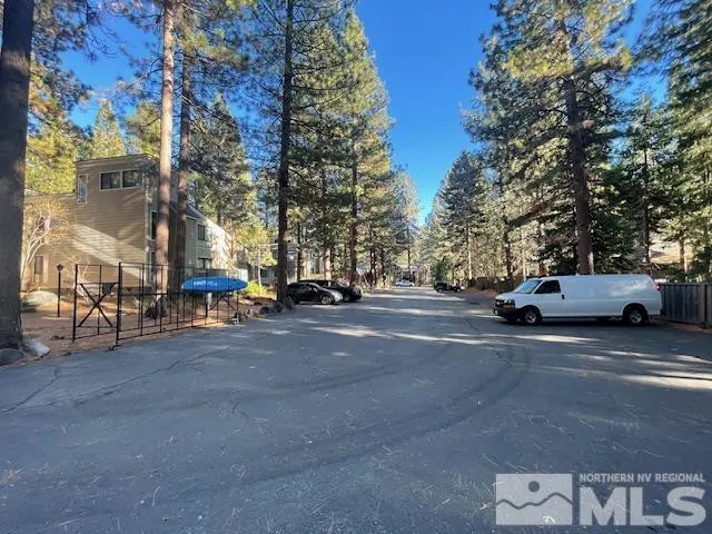 a view of street with parked cars