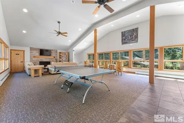 a view of a livingroom with hardwood floor and a ceiling fan