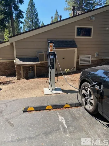 a view of a patio with table and chairs