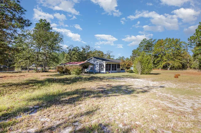 a view of house with outdoor space