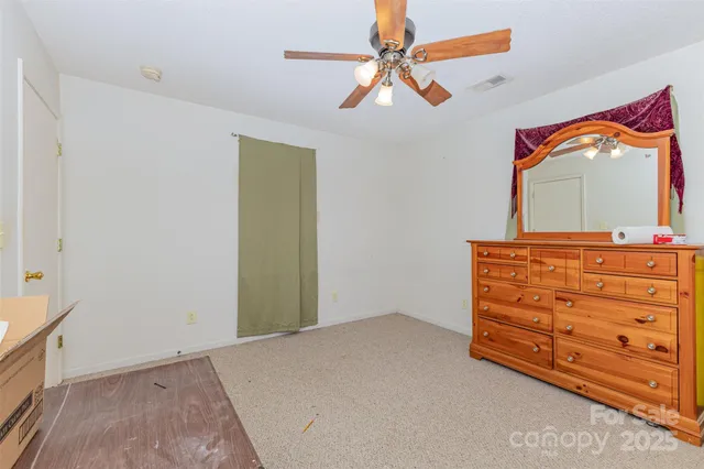 a room with a dresser and a mirror