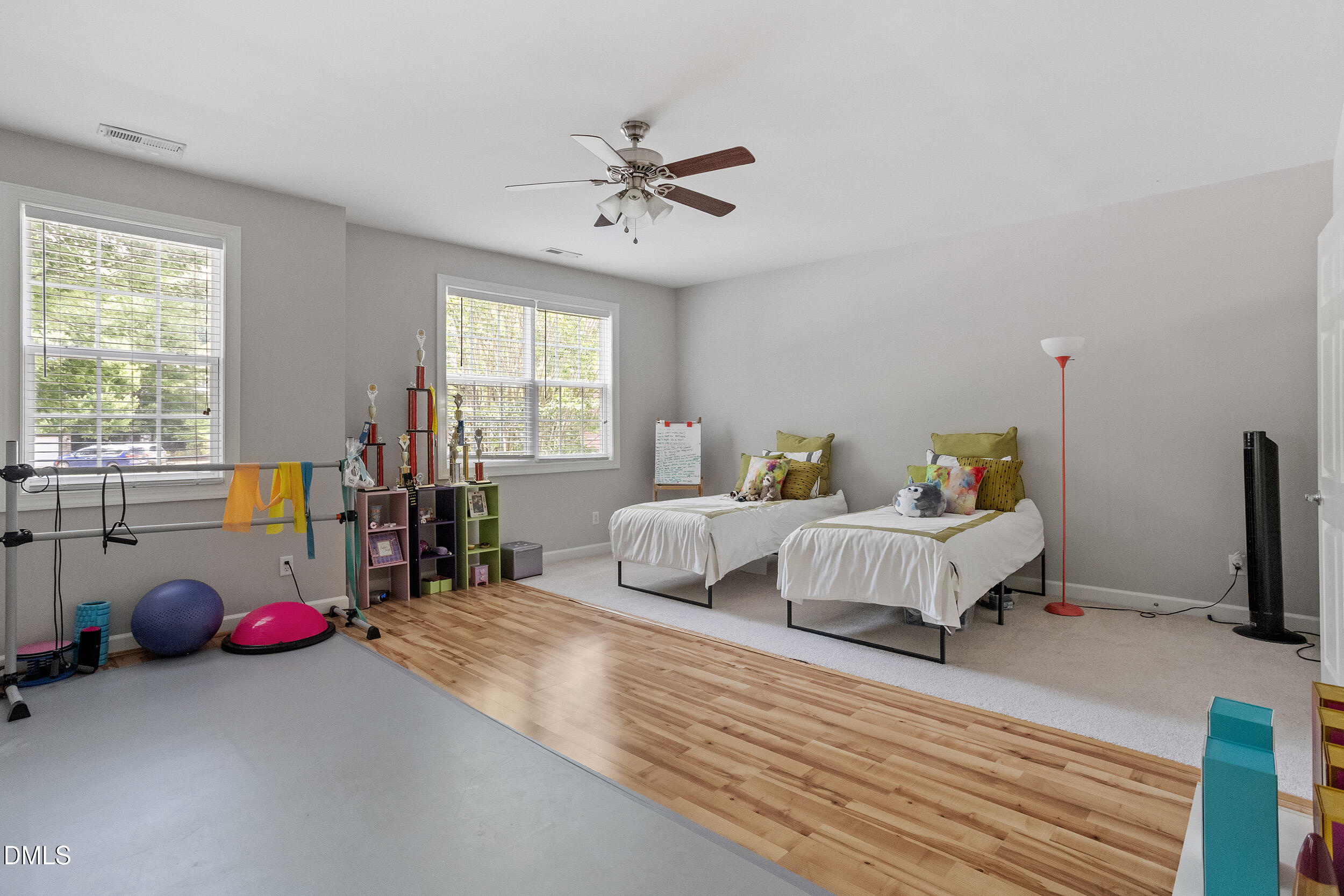 1019 Bianco Drive Raleigh, NC 27607 - Photo 23 of 29 a bedroom with a bed and a chandelier