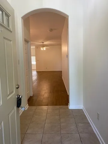 an empty room with a bench in it