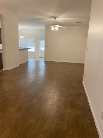 en empty room with wooden floor
