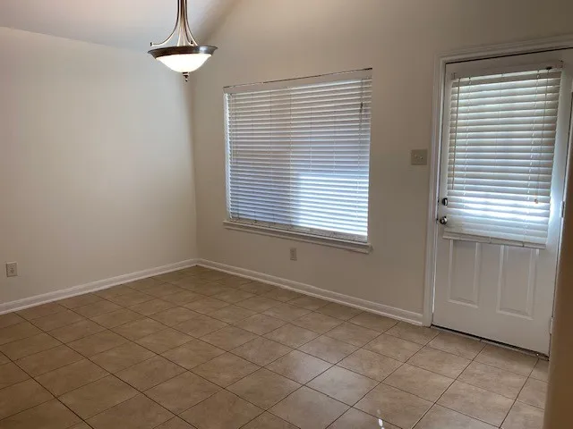 an empty room with windows