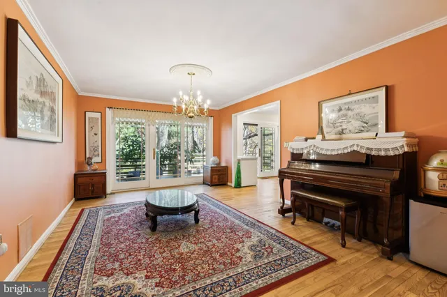 a living room with furniture and a piano
