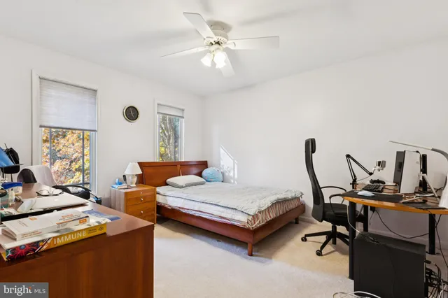 a bedroom with furniture and a window