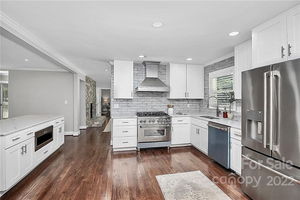 225 Morning Dale Road Matthews, NC 28105 - Photo 11 of 48 a kitchen with a stove top oven and refrigerator