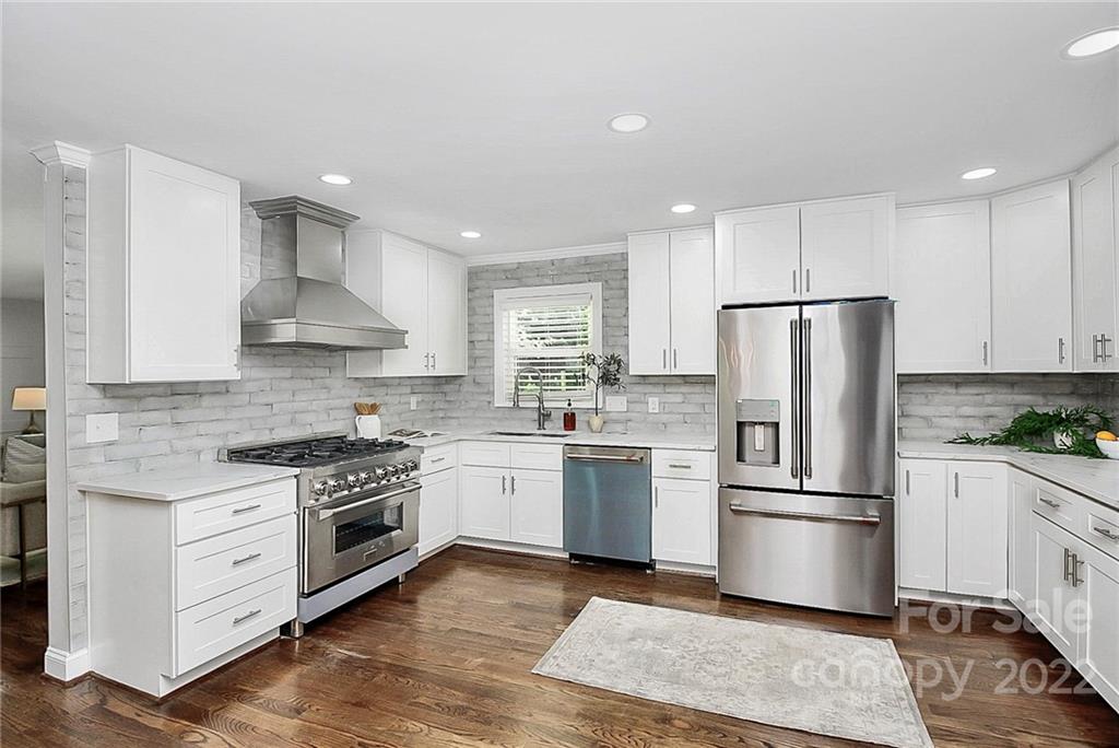 225 Morning Dale Road Matthews, NC 28105 - Photo 12 of 48 a kitchen with a stove refrigerator sink and microwave