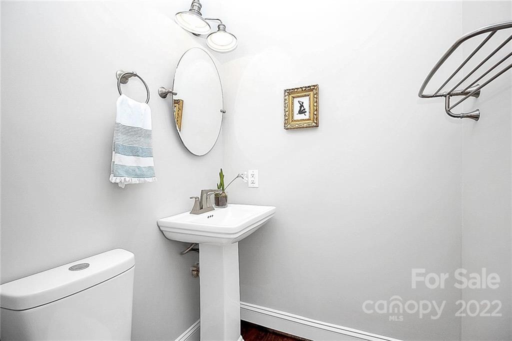 225 Morning Dale Road Matthews, NC 28105 - Photo 15 of 48 a bathroom with a sink a mirror and a toilet