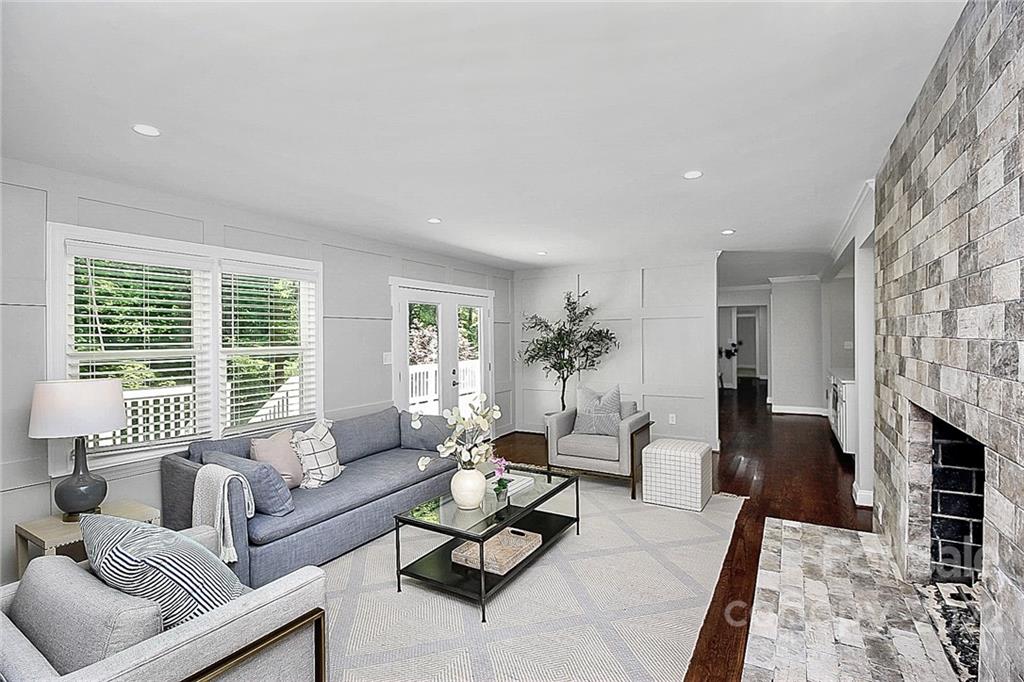 225 Morning Dale Road Matthews, NC 28105 - Photo 16 of 48 a living room with furniture or couch and a fireplace